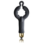 Anneau pénien en silicone noir à large boucle ouverte et picots intérieurs, capsule vibrante dorée à la base, surface mate lisse non anatomique du pack Silhouette.