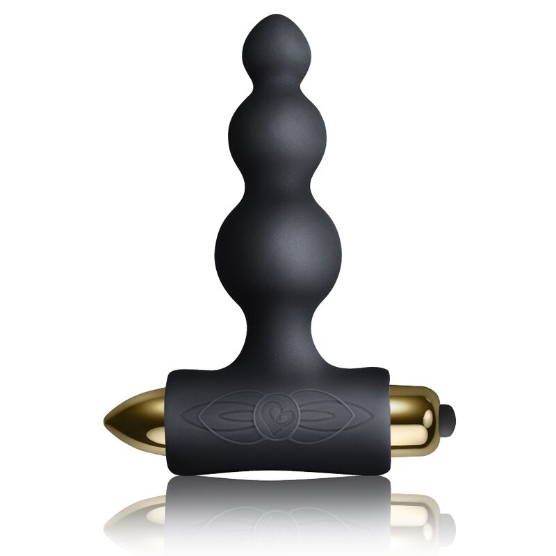 Plug anal noir à tige perlée de billes étagées sur base en T, capsule vibrante dorée logée dans le socle, silicone mat lisse, format du pack Silhouette.