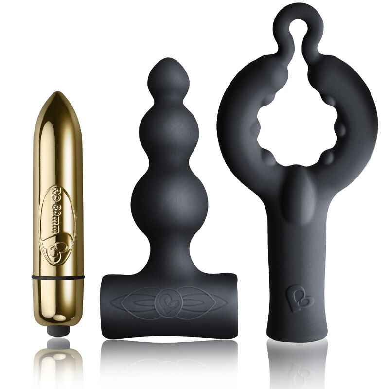 Trois pièces du pack Silhouette posées : bullet dorée, plug noir perlé à base en T et anneau pénien noir à boucle, tous en silicone lisse non anatomique.
