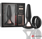 Coffret Anbiguo Alexandru : plug anal vibrant en silicone noir et sa telecommande montre Watchme, presentes devant l'emballage marbre, jeu anal etanche rechargeable.