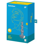 Boîte bleue Lolli Plug 2 Satisfyer au trait visage stylisé, illustrant la version grise du plug anal perlé, mention Plug et programmes de vibration.