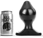 Plug anal PVC souple All Black noir pres de sa canette, profil de toupie bombee et large base trapeze, format 17 cm flexible pour une ouverture anale progressive et confortable.