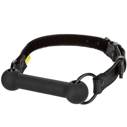 Bâillon à barre Boundless, barre en silicone noir de 7,5 cm montée sur une sangle en cuir synthétique réglable, accessoire de domination pour couple.