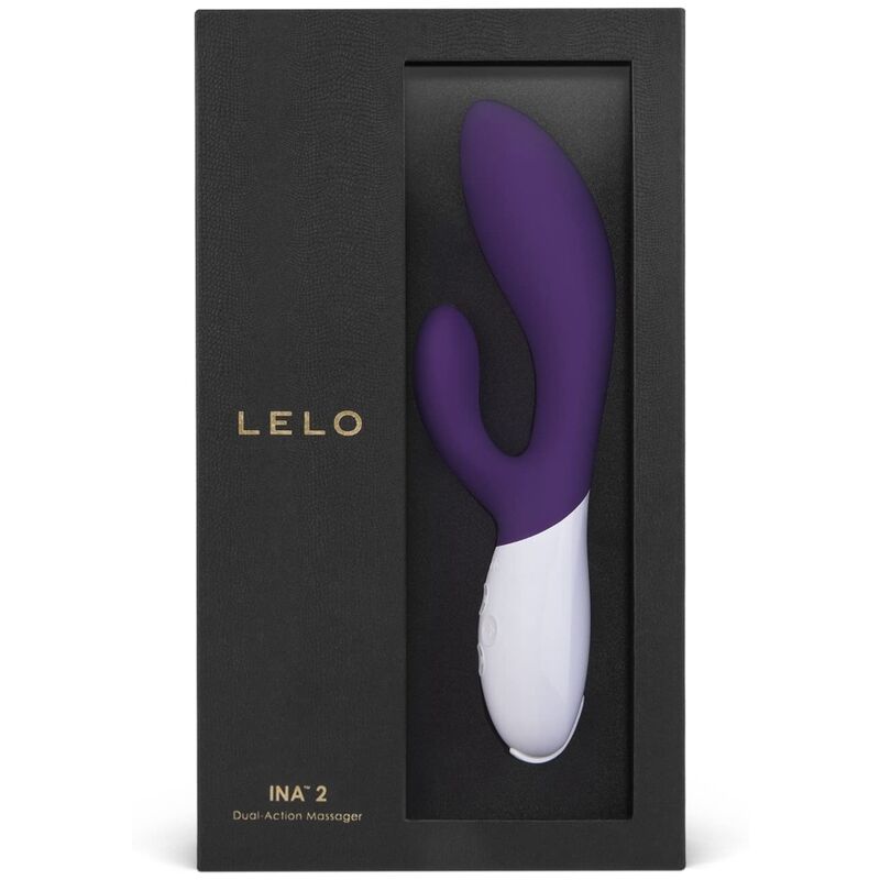 Boite Lelo Ina 2 violet de face, rabbit a manche blanc sous fenetre, masseur double action point G et clitoris en silicone biocompatible, emballage noir premium.
