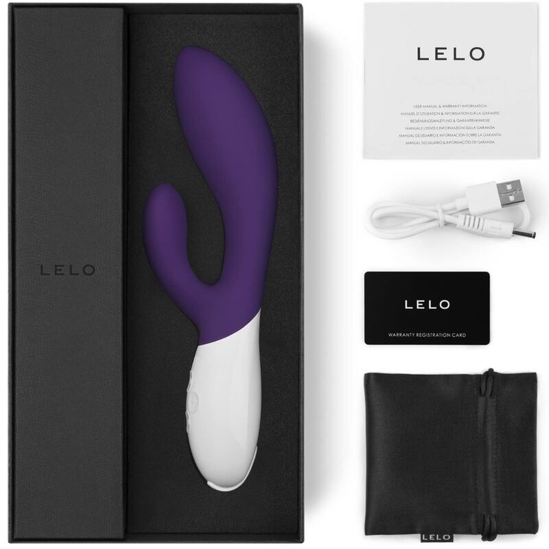 Coffret Lelo Ina violet ouvert avec notice, cable USB, carte de garantie et pochette satinee noire, rabbit double stimulation point G et clitoris en silicone a manche blanc.