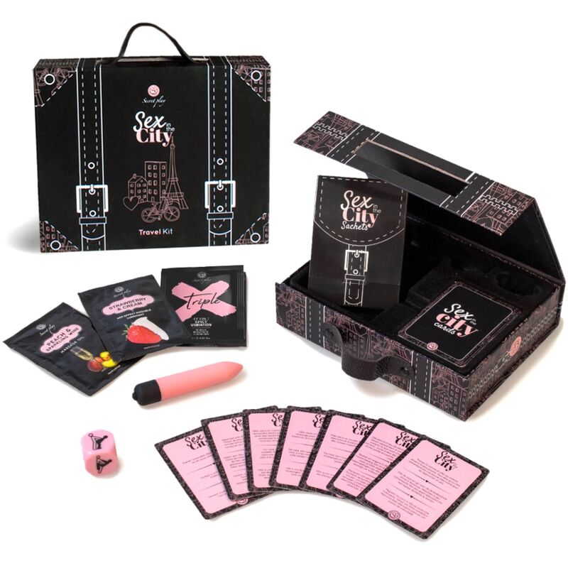 Kit Sex in the City Secretplay : valisette noire ouverte avec balle vibrante rose, de et cartes etalees, kit de voyage coquin urbain 40 cartes pour couple.