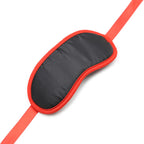Masque fétichiste noir à bords rouges — emballage produit