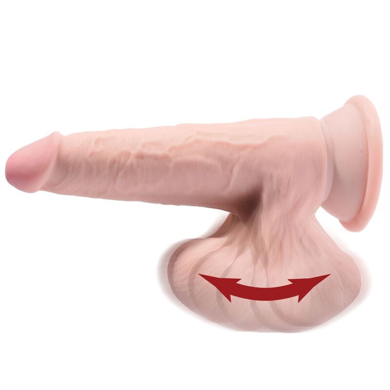 Gode King Cock Plus triple densité ton chair couché, gland charnu et testicules ballants moulés, flèche illustrant le balancement des testicules.