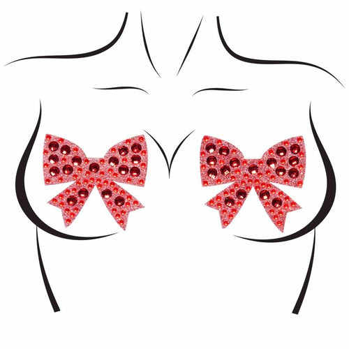 Cache-tetons noeud a strass rouge Leg Avenue presentes sur silhouette schematique : bijoux de poitrine pailletes, sans peau ni corps reel.