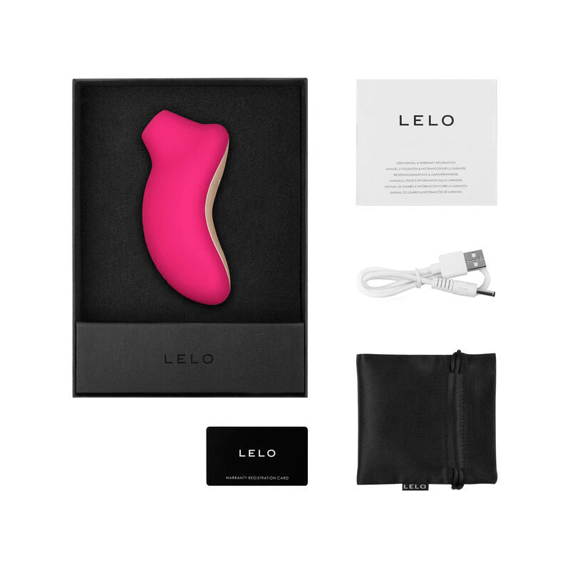 Stimulateur clitoridien Sona 2 Cruise rose vif dans son coffret avec câble USB et pochette satin Lelo, masseur sonique en silicone à embout d'aspiration arrondi.