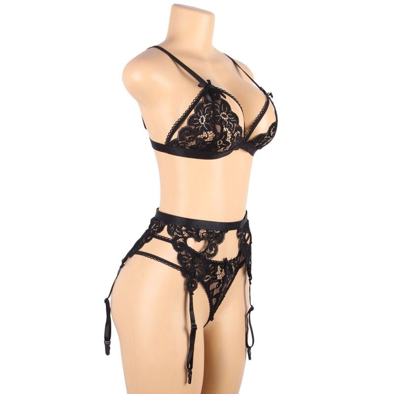 Ensemble lingerie dentelle noire Subblime sur buste mannequin de trois quarts, soutien-gorge, porte-jarretelles a sangles et string a cœur.
