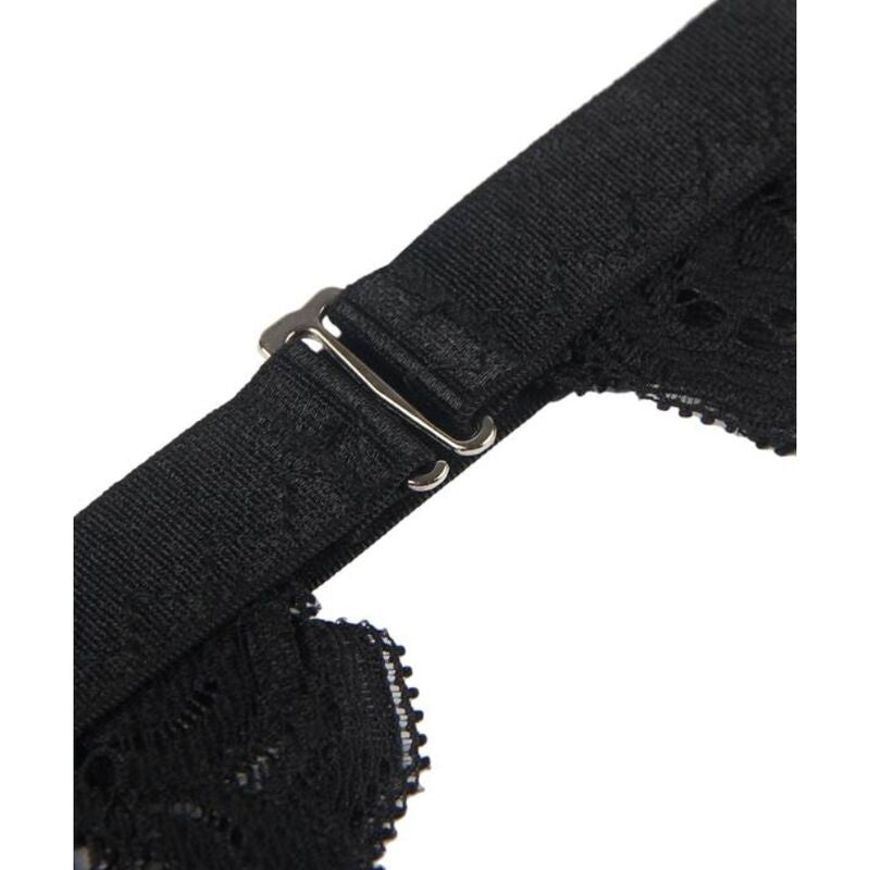 Detail de la boucle metallique reglable du porte-jarretelles Subblime sur bande elastique noire, bordure dentelle florale visible en bas.
