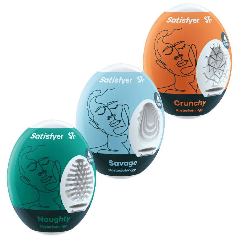 Trois oeufs masturbateurs Satisfyer vert, bleu et orange empiles, inserts blancs textures visibles, dessins de visages au trait sur les coques colorees.
