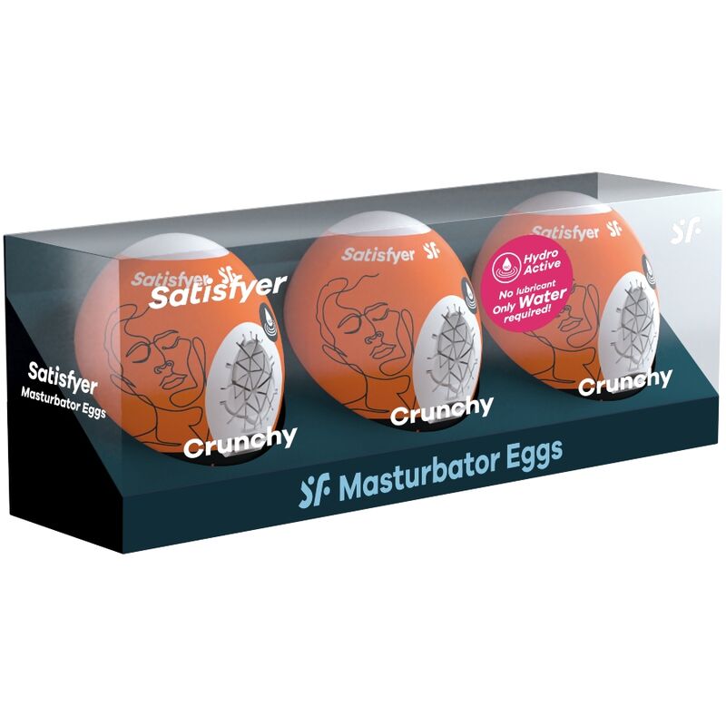 Assortiment d'oeufs masturbateurs Satisfyer aux couleurs variees, gaines blanches a textures differentes, coffret noir multi-modeles a l'arriere plan.