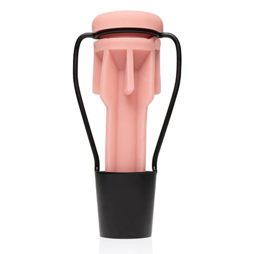Support de sechage Stand Dry Fleshlight avec manchon rose et orifice moule visible, maintenu droit sur sa base noire pour secher la gaine apres usage.
