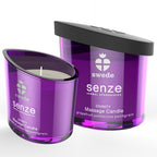 Bougie de massage Senze Divinity pamplemousse palmarosa petitgrain, verre violet allume aux cotes de son couvercle, cire fondante transformee en huile hydratante.