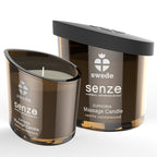 Bougie de massage Senze Euphoria vanille bois de santal, verre brun fume allume devant sa boite, cire chaude nourrissante qui se transforme en huile.