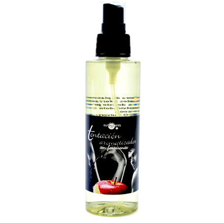Flacon spray d'ambiance Tentacion fruit de la passion 150 ml aux pheromones, vaporisateur transparent etiquette noire pose sur satin sombre pour atmosphere sensuelle