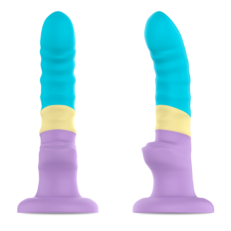 Gode Colby Pastel tricolore vu de face et de profil sur base ventouse, tige lisse incurvee a tete arrondie en silicone souple, design fantaisie turquoise jaune et violet pastel.