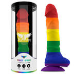 Gode Corey Pride Mythology arc-en-ciel a la forme penienne avec testicules moules, presente dans son tube cylindrique et pose a cote, base ventouse violette
