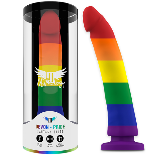 Gode Devon Pride Mythology en silicone arc-en-ciel a la forme penienne marquee, presente dans son tube cylindrique et pose a cote, base ventouse violette