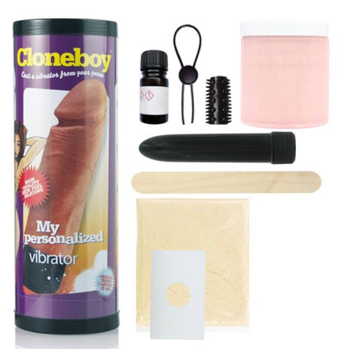 Tube Cloneboy vibrator de profil et contenu du kit etale : vibro noir, anneau, brosses de texture, pot de moulage rose et poudre silicone pour repliquer le penis.