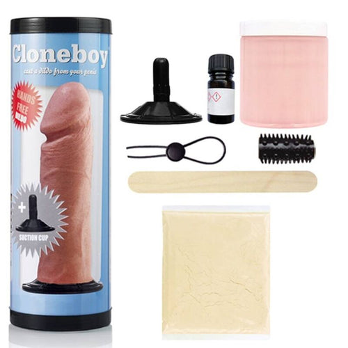 Tube Cloneboy bleu de profil avec accessoires : ventouse noire, fiole, anneau penien, brosse texturee, pot de moulage rose et sachet de poudre silicone du kit.