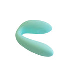 Stimulateur couple Xocoon menthe vu en plongee, forme en U entierement lisse en silicone, deux branches souples pour stimulation simultanee du couple.