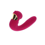 Stimulateur Celestial Love fuchsia vu de trois quarts, ouverture doree du moteur clitoridien et longue branche silicone, design ergonomique double fonction.