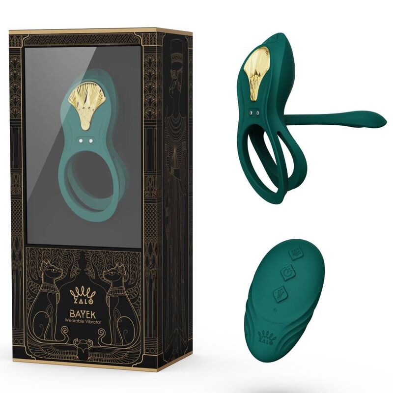Boîte Bayek noire et dorée à félins égyptiens présentée avec le cockring vert et sa télécommande galet verte posés à côté, ensemble de couple complet.