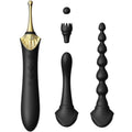 Stimulateur Bess 2 noir et or avec ses embouts interchangeables alignés : pointe fine, brosse à picots, bille et tige perlée, accessoires lisses sans anatomie.