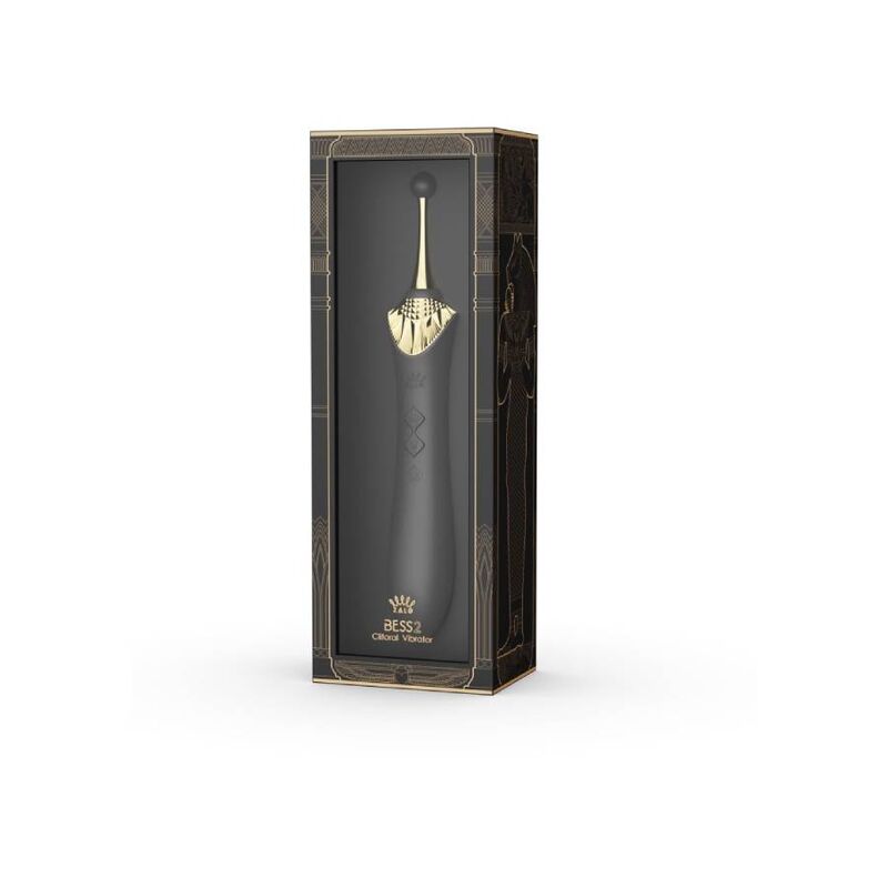 Boîte verticale noire et dorée du Bess 2 à fenêtre transparente, laissant entrevoir le stimulateur noir dans son écrin orné de motifs égyptiens. Marque Zalo, gamme Bess 2 noire.