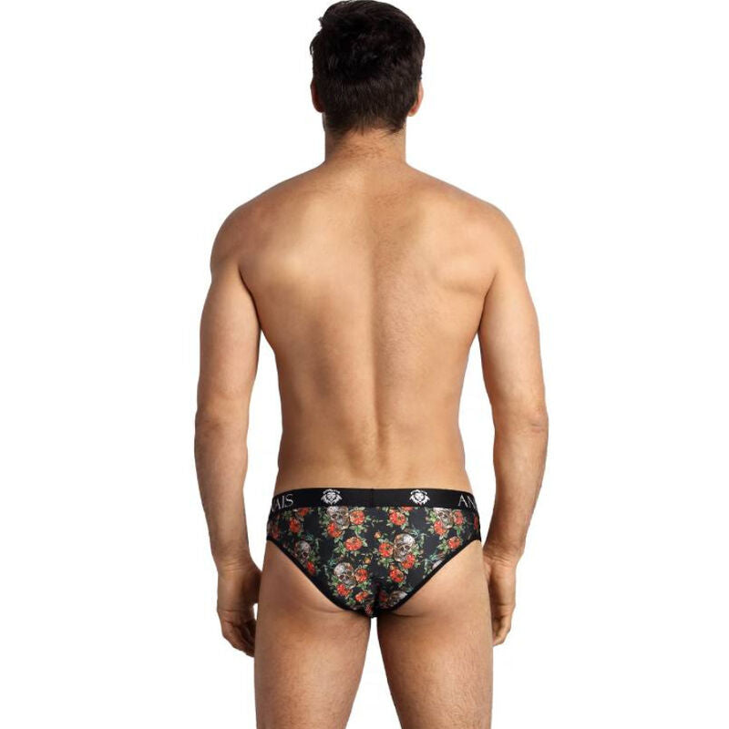 Slip homme Power roses et tetes de mort vu de dos sur mannequin au torse denude, imprime floral sombre et large bande de taille elastique signee Anais.
