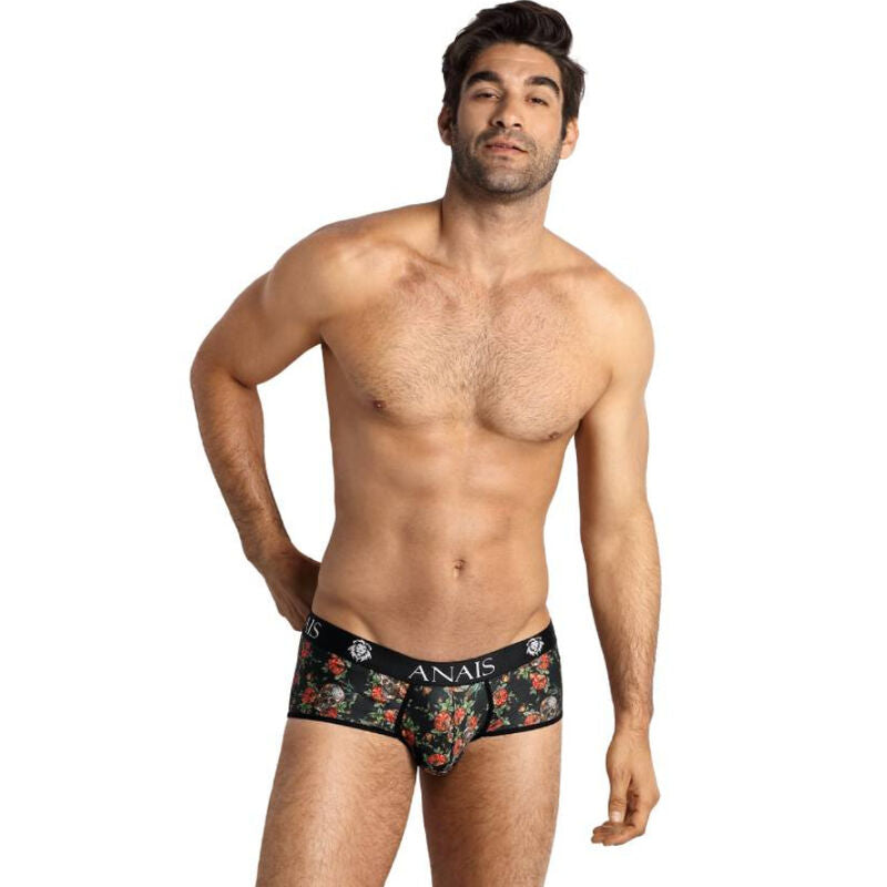 Slip homme roses et tetes de mort porte de trois quarts par un mannequin torse nu, imprime floral macabre, coupe sportive ajustee et ceinture logo Anais.