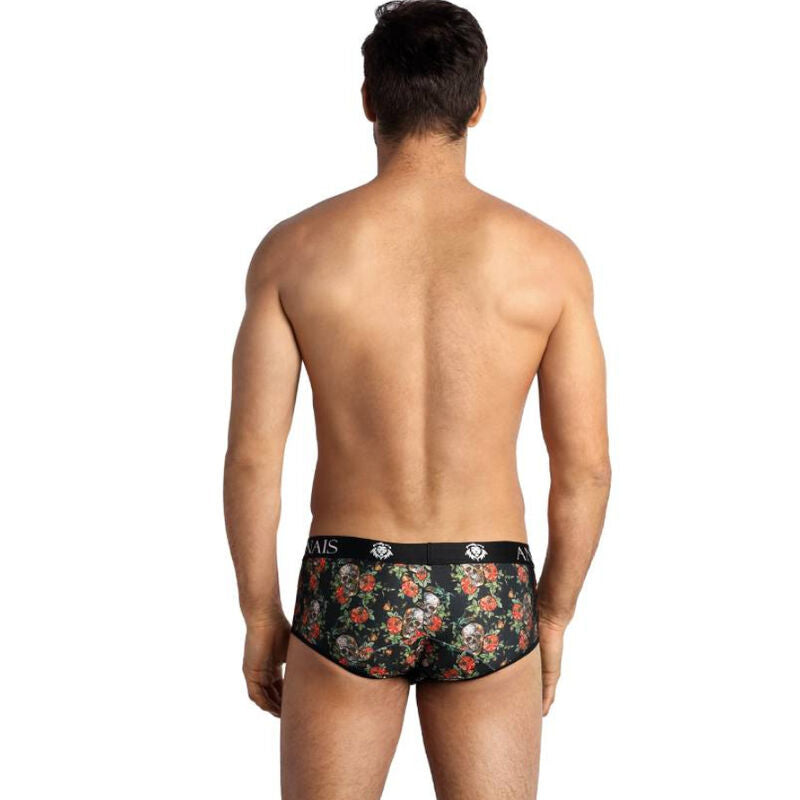 Slip homme roses et tetes de mort porte de dos par un modele torse nu, coupe sportive jambes courtes en maille douce, vue arriere mettant en valeur la coupe ajustee Anais.
