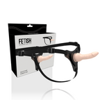 Gode-ceinture realiste Fetish Submissive en silicone chair vu de cote, gland marque et harnais noir a boucles reglables, ensemble strap-on pour la penetration.