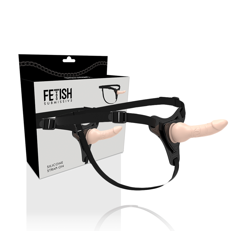 Gode-ceinture realiste Fetish Submissive en silicone chair vu de cote, gland marque et harnais noir a boucles reglables, ensemble strap-on pour la penetration.
