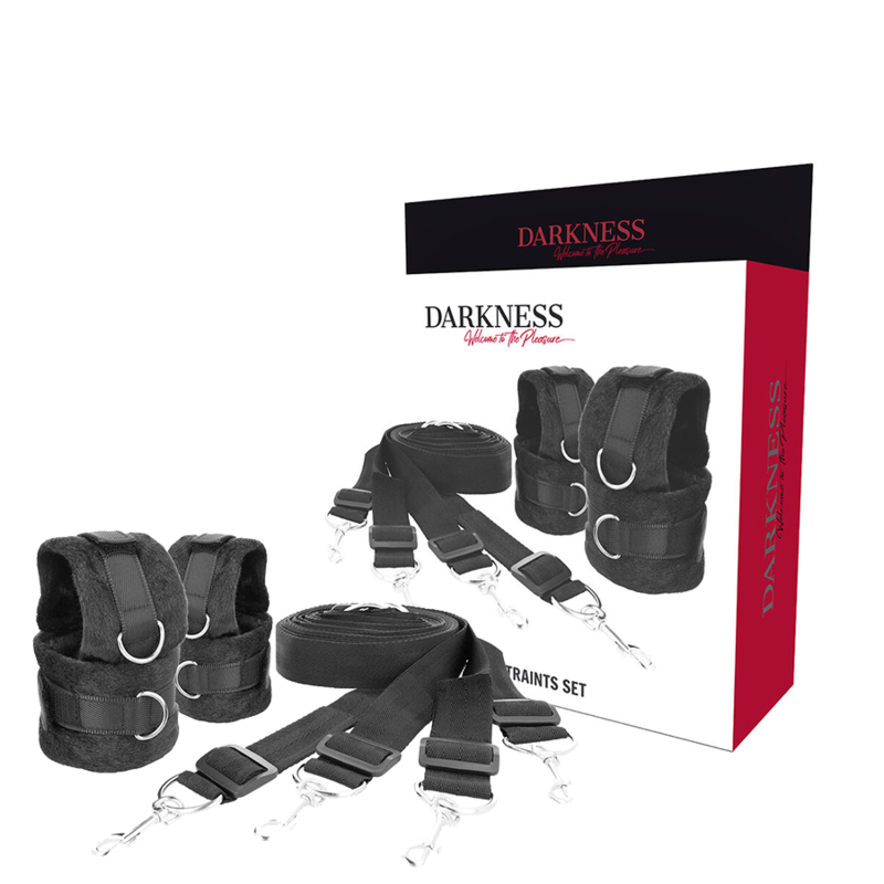 Boite Darkness Luxury Bed Restraints Set presentant un kit d'attaches de lit en neoprene noir avec sangles, manchettes fourrure et mousquetons pour immobilisation au matelas.