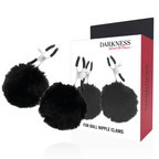 Pinces a tetons a pompons Darkness posees devant leur boite Fur Ball Nipple Clams, mors metalliques reglables et boules de fausse fourrure noire pour les mamelons.