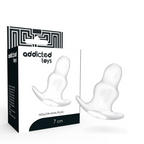 Plug anal creux Addicted Toys 7 cm en silicone translucide presente a cote de sa boite Hollow Anal Plug, forme tunnel souple a base courbee de maintien.