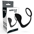 Boite Addicted Toys 10 cm avec le plug anal a anneau penien en silicone noir lisse, accessoire deux en un plug et bague, emballage graphique.