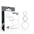 Set transparent Addicted Toys de trois anneaux reliés pour pénis et testicules, présenté près de sa boîte.