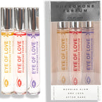 Coffret 3 parfums aux pheromones pour femme : trio de roll-on Morning Glow, One Love et After Dark devant l emballage Pheromone Parfum Eye Of Love.