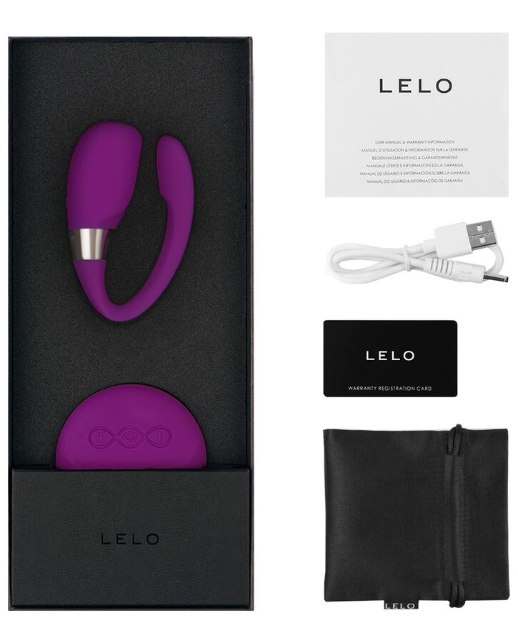 Coffret Lelo Tiani 3 violet ouvert avec notice, cable USB, carte garantie et pochette satin, stimulateur de couple a porter en silicone.