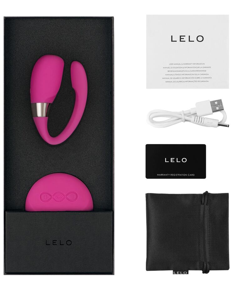 Coffret Lelo Tiani 3 rose ouvert avec notice, cable USB, carte garantie et pochette satin, stimulateur de couple a porter en silicone.