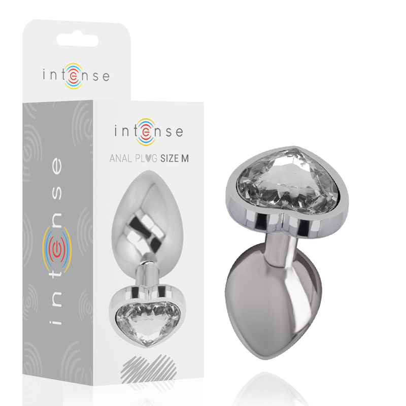 Boite Intense Anal Plug Size M et le plug bijou metal a pierre transparente, embout conique lisse et base coeur sertie, presentes ensemble sur fond clair