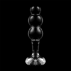 Plug anal en verre borosilicate teinte fume sur fond noir, trois perles superposees et base fleur, vue de face, matiere thermique non poreuse Nebula Series.