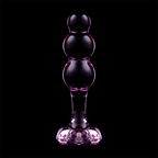 Plug anal en verre borosilicate teinte rose-violet sur fond noir, perles empilees et base fleur, vue de face, surface lisse pour stimulation thermique douce.