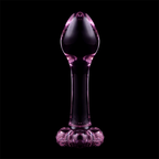 Plug anal fin en verre borosilicate teinte rose-violet sur fond noir, tete bombee et base fleur sculptee, vue de face, surface lisse non poreuse pour debuter.