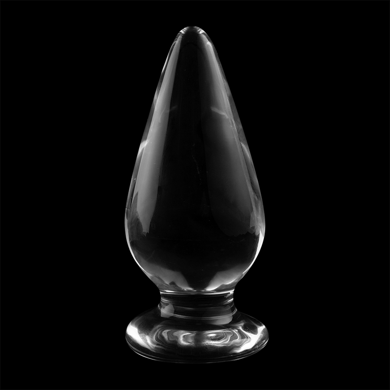 Plug anal en verre borosilicate transparent forme goutte sur fond noir, corps effile brillant et base annelee, vue de face, matiere thermique non poreuse.